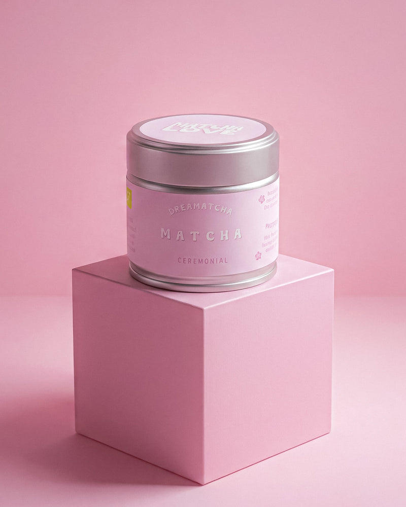 Jar of matcha by dreamatcha on a pink platform with a pink background